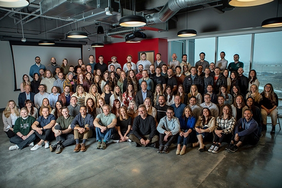 Disruptive Advertising large group staff photo in the office